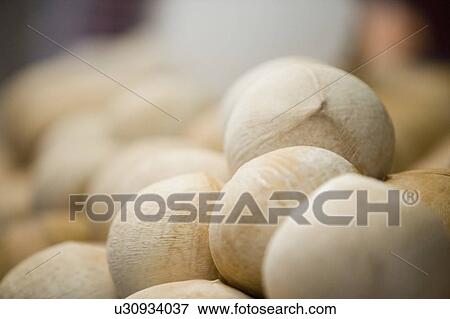 Close-up of a heap of coconuts at a market stall View Large Photo Image Stock Photo - Close-up of a heap of coconuts at a market stall. Fotosearch