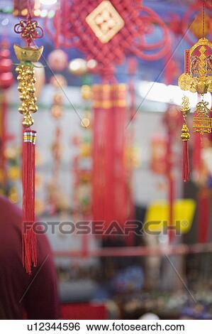 Stock Photograph - Close-up of good luck charms at a market stall. Fotosearch