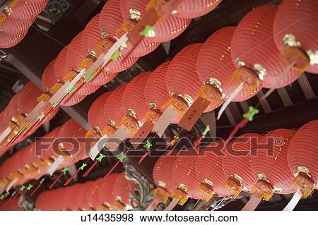 Stock Photo - Low angle view of Chinese lanterns in a temple. Fotosearch