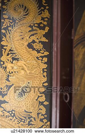 Stock Image - Close-up of a painting of a dragon in a temple. Fotosearch