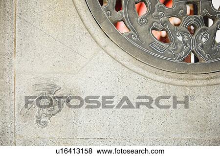 Stock Photo - Close-up of a stone window of a temple. Fotosearch