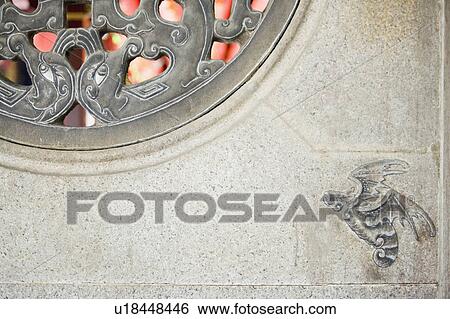Stock Photograph - Close-up of a stone window of a temple. Fotosearch