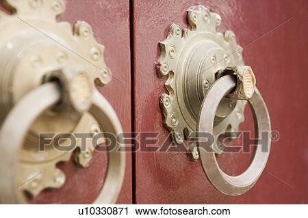 Close-up of two doorknockers on a door View Large Photo Image Stock Image - Close-up of two doorknockers on a door. Fotosearch