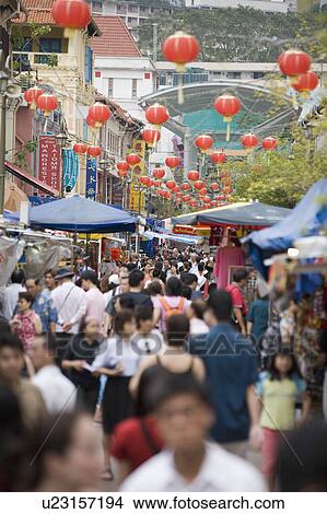 Crowd walking in a street market in a city, Chinatown, Singapore View Large Photo Image Picture - Crowd walking in a street market in a city, Chinatown, Singapore. Fotosearch