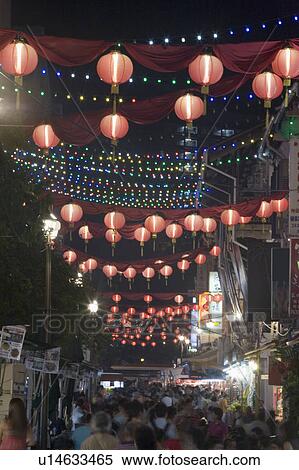 Crowd Walking On The Street Decorated With Chinese Lanterns At