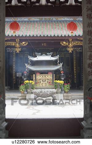 Stock Photograph - Decorative urn in a courtyard of a temple. Fotosearch