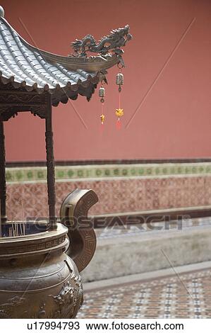 Stock Image - Decorative urn in a temple. Fotosearch