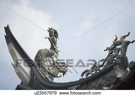 Low angle view of a dragon sculpture in a temple View Large Photo Image Stock Photo - Low angle view of a dragon sculpture in a temple. Fotosearch