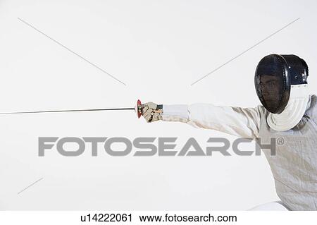 Close-up of a man practicing fencing View Large Photo Image Stock Image - Close-up of a man practicing fencing. Fotosearch