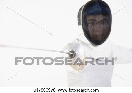 Stock Photograph - Close-up of a man practicing fencing. Fotosearch
