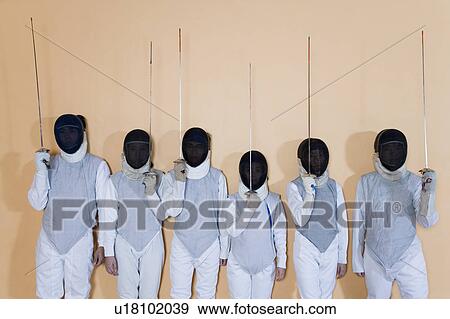 Stock Photo - Group of people in fencing costume standing side by side. Fotosearch