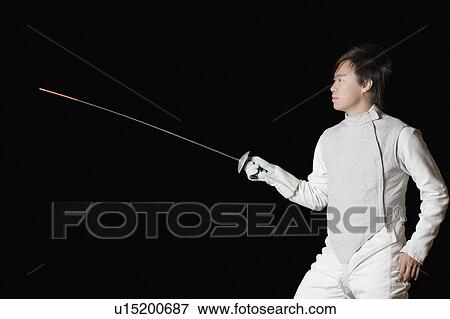 Stock Photo - Male fencer holding a fencing foil. Fotosearch