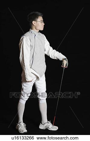 Stock Photograph - Male fencer holding a fencing foil. Fotosearch