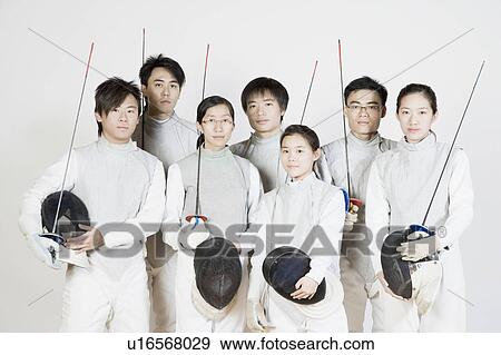 Stock Photo - Portrait of a group of fencers standing together. Fotosearch