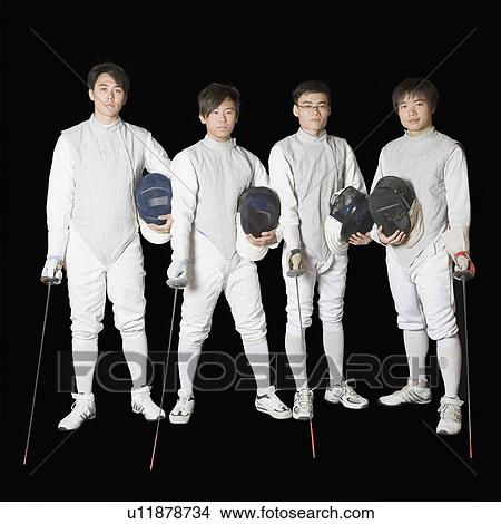 Portrait of four male fencers holding fencing foils and fencing masks View Large Photo Image Picture - Portrait of four male fencers holding fencing foils and fencing masks. Fotosearch