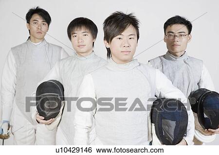 Stock Photograph - Portrait of four male fencers standing. Fotosearch