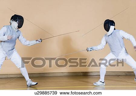 Stock Photo - Two fencers fencing. Fotosearch