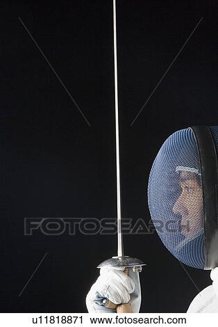 Close-up of a male fencer holding a fencing foil View Large Photo Image Stock Image - Close-up of a male fencer holding a fencing foil. Fotosearch