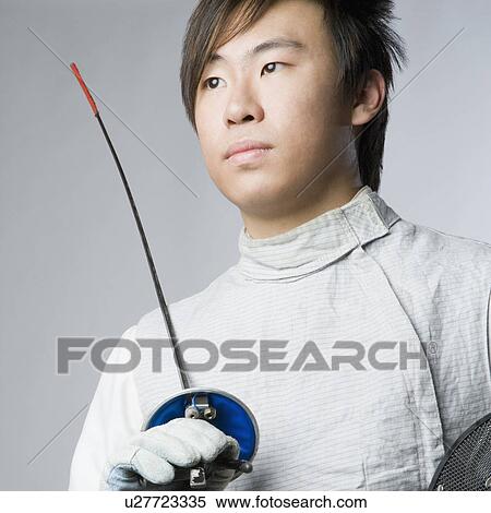Close-up of a male fencer holding a sword and a fencing mask View Large Photo Image Stock Photography - Close-up of a male fencer holding a sword and a fencing mask. Fotosearch