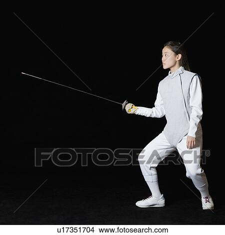 Female fencer holding a fencing foil View Large Photo Image Picture - Female fencer holding a fencing foil. Fotosearch