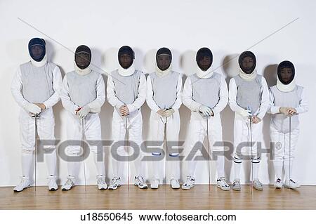 Stock Photography - Group of people in fencing costume standing side by side. Fotosearch