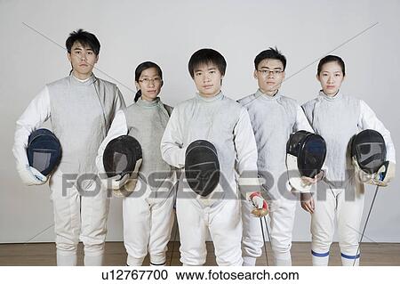Stock Image - Portrait of five fencers standing together. Fotosearch