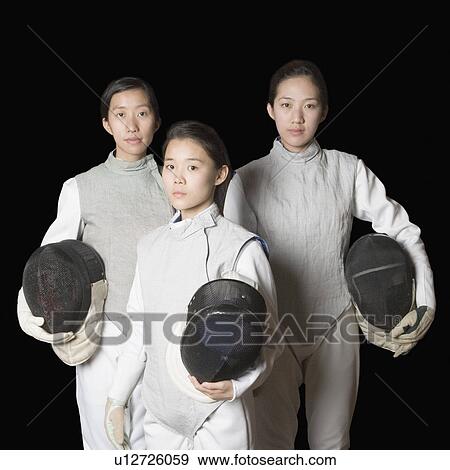 Portrait of three female fencers holding fencing masks View Large Photo Image Stock Photo - Portrait of three female fencers holding fencing masks. Fotosearch
