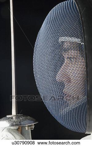 Side profile of a male fencer holding a fencing foil View Large Photo Image Stock Photo - Side profile of a male fencer holding a fencing foil. Fotosearch