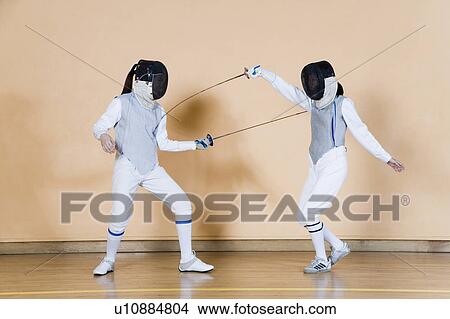 Two fencers fencing View Large Photo Image Picture - Two fencers fencing. Fotosearch