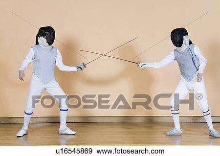 Stock Photo - Two fencers fencing. Fotosearch