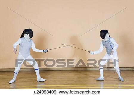 Stock Photo - Two fencers fencing. Fotosearch