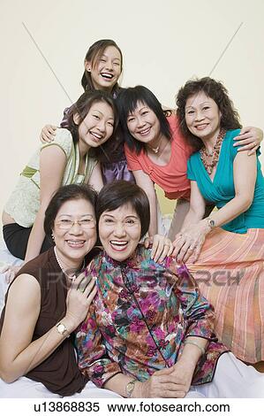 Portrait of three senior women and a mature woman smiling with a young woman View Large Photo Image Stock Photography - Portrait of three senior women and a mature woman smiling with a young woman. Fotosearch