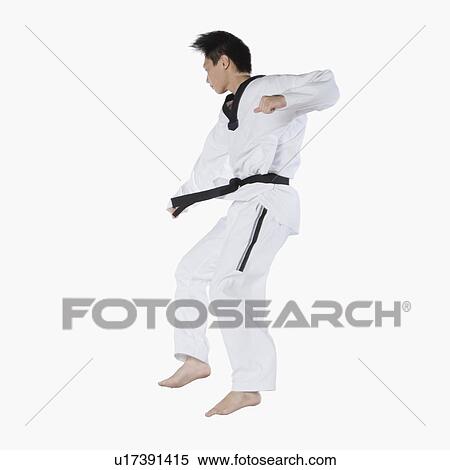 Close-up of a mid adult man jumping and practicing martial arts View Large Photo Image Stock Photography - Close-up of a mid adult man jumping and practicing martial arts. Fotosearch