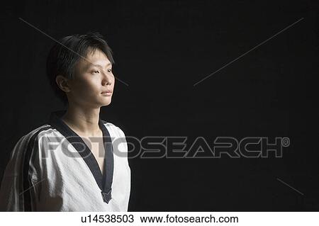 Close-up of a mid adult man contemplating View Large Photo Image Stock Image - Close-up of a mid adult man contemplating. Fotosearch