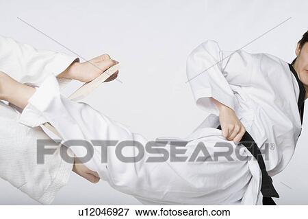 Close-up of a woman practicing kickboxing View Large Photo Image Stock Photo - Close-up of a woman practicing kickboxing. Fotosearch