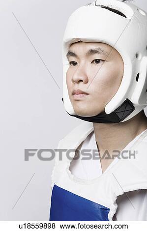 Close-up of a young man wearing a sports helmet View Large Photo Image Stock Photo - Close-up of a young man wearing a sports helmet. Fotosearch