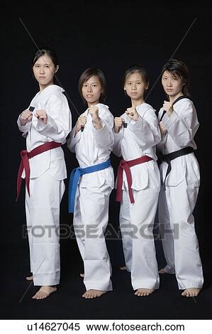 Four young women standing in punching position View Large Photo Image Stock Photography - Four young women standing in punching position. Fotosearch