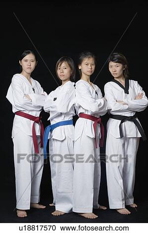 Four young women standing View Large Photo Image Stock Image - Four young women standing. Fotosearch