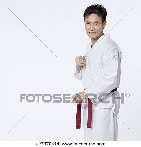 Portrait of a young man in fighting stance View Large Photo Image Picture - Portrait of a young man in fighting stance. Fotosearch