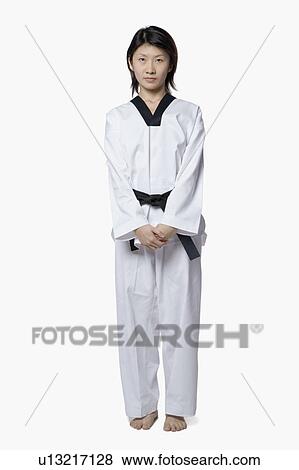Portrait of a young woman standing View Large Photo Image Stock Photo - Portrait of a young woman standing. Fotosearch