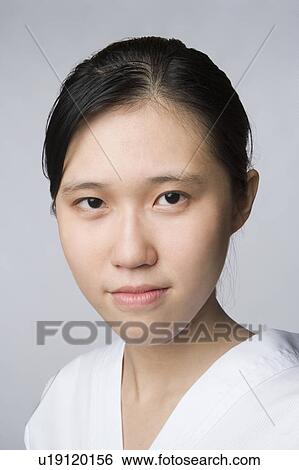 Stock Photograph - Portrait of a young woman. Fotosearch