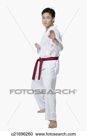 Young man practicing karate View Large Photo Image Stock Image - Young man practicing karate. Fotosearch