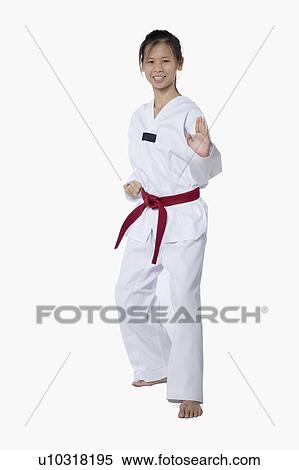Young woman practicing karate and smiling View Large Photo Image Stock Photography - Young woman practicing karate and smiling. Fotosearch