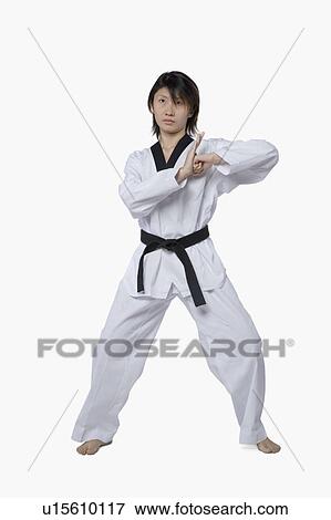 Young woman practicing karate View Large Photo Image Stock Photo - Young woman practicing karate. Fotosearch