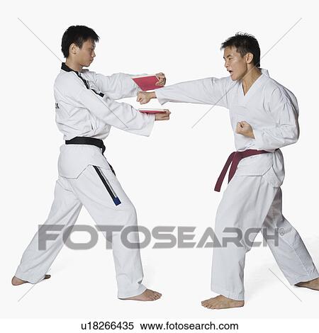 Male karate instructor teaching martial arts to a young man View Large Photo Image Stock Photography - Male karate instructor teaching martial arts to a young man. Fotosearch