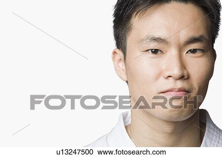 Portrait of a young man looking confident View Large Photo Image Stock Image - Portrait of a young man looking confident. Fotosearch