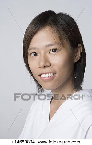 Picture - Portrait of a young woman smiling. Fotosearch