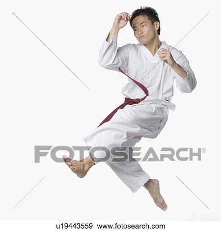 Stock Photo - Young man posing in mid-air. Fotosearch