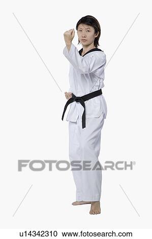 Young woman practicing karate View Large Photo Image Stock Image - Young woman practicing karate. Fotosearch