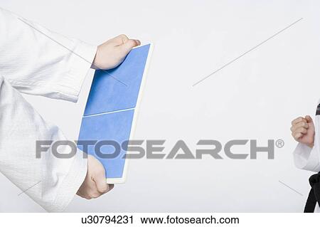 Close-up of a person's hands holding a tile View Large Photo Image Stock Image - Close-up of a person's hands holding a tile. Fotosearch